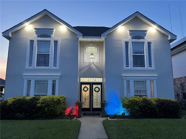 view of front of home with a yard