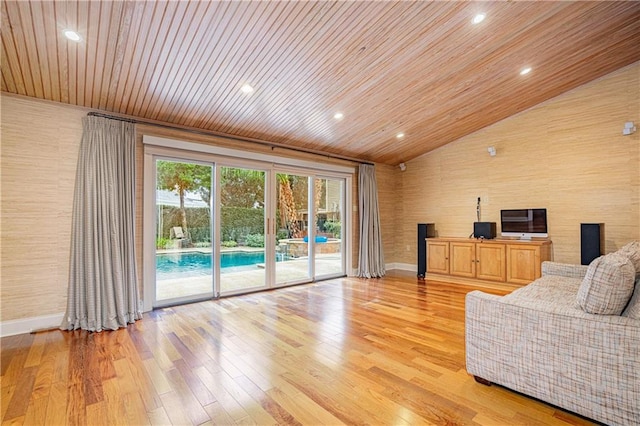 living room with wood ceiling, light wood-type flooring, and vaulted ceiling