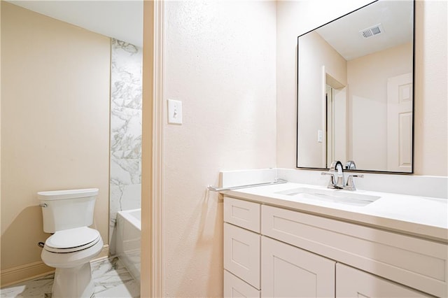 bathroom featuring vanity and toilet