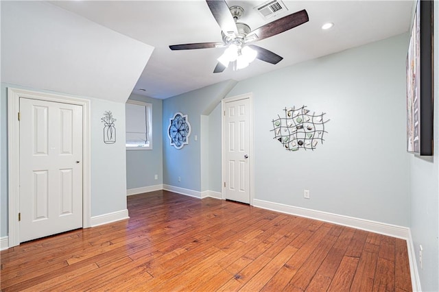 interior space featuring wood-type flooring and ceiling fan