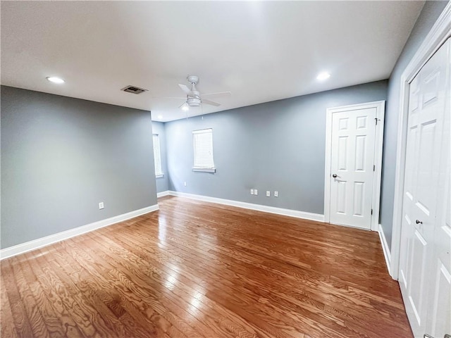 unfurnished room with wood-type flooring and ceiling fan