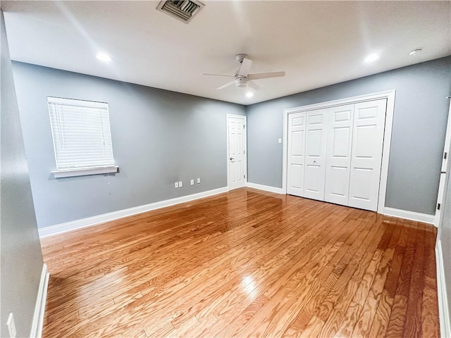 unfurnished bedroom featuring ceiling fan and light hardwood / wood-style flooring