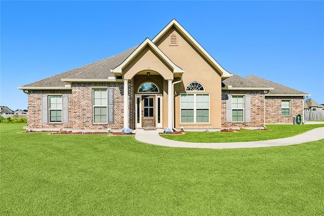 ranch-style home with a front yard