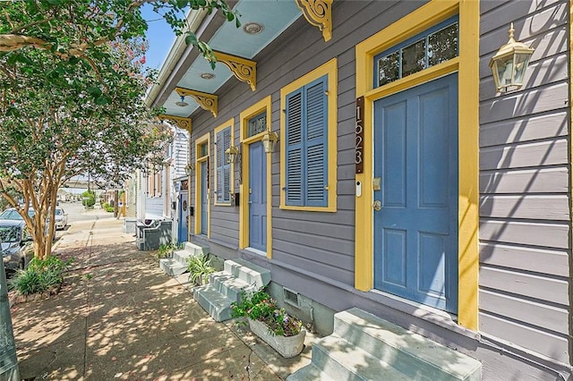 view of side of property with entry steps