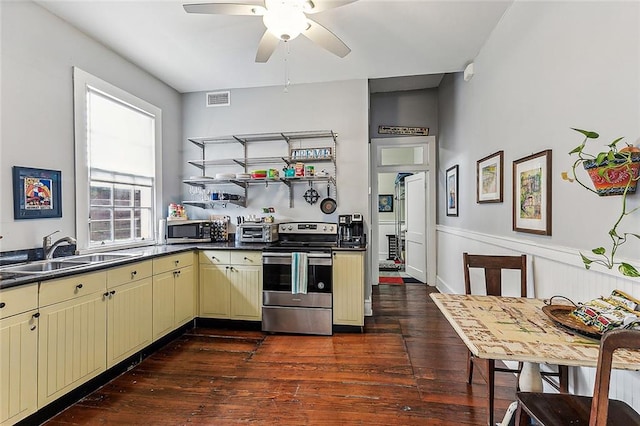 kitchen with ceiling fan, sink, stainless steel appliances, and dark wood-type flooring