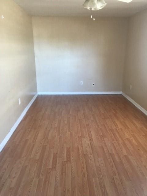 unfurnished room with hardwood / wood-style floors