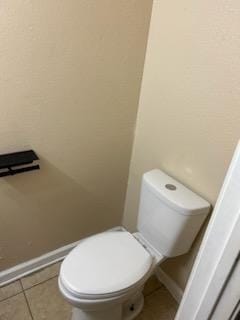 bathroom with tile patterned floors and toilet