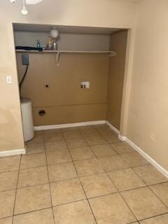 clothes washing area featuring tile patterned floors, electric dryer hookup, and washer hookup