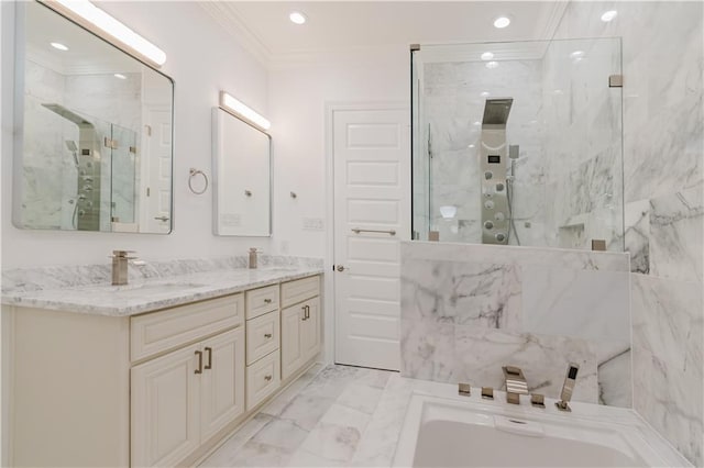 bathroom with ornamental molding, independent shower and bath, and vanity