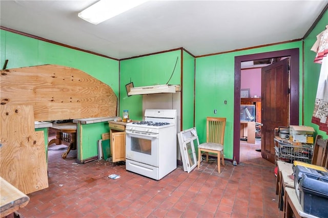 kitchen featuring exhaust hood, ornamental molding, and white range with gas cooktop