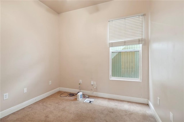 empty room with light colored carpet