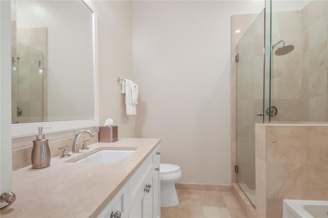 bathroom featuring tile patterned flooring, vanity, toilet, and a shower with shower door