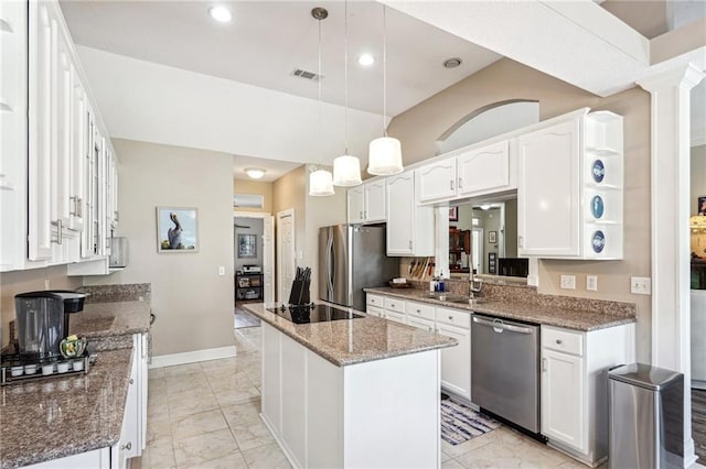 kitchen featuring stainless steel appliances, white cabinets, hanging light fixtures, and a kitchen island