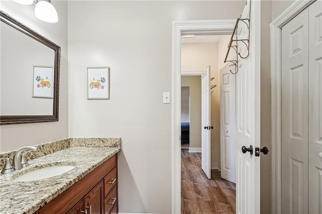 bathroom with vanity and hardwood / wood-style floors