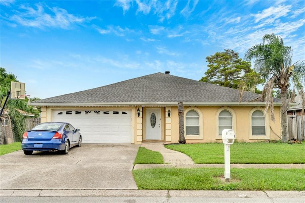 7001 Morrison Rd, New Orleans, LA 70127 - single story home with a garage and a front lawn