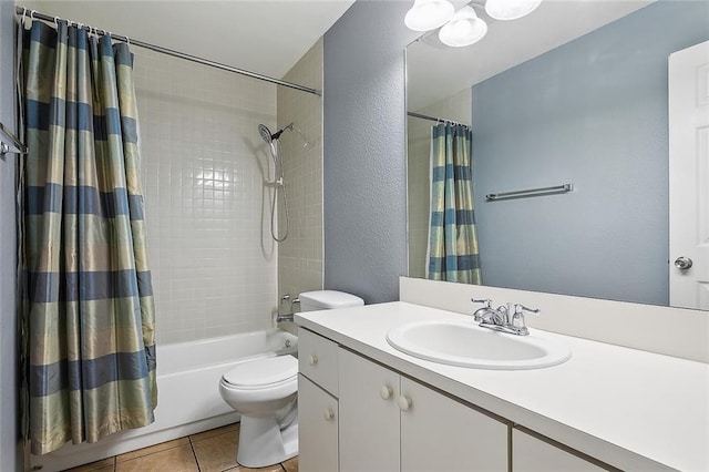 full bathroom featuring shower / tub combo, tile patterned flooring, vanity, and toilet