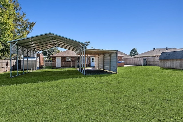 view of yard with a shed and a carport