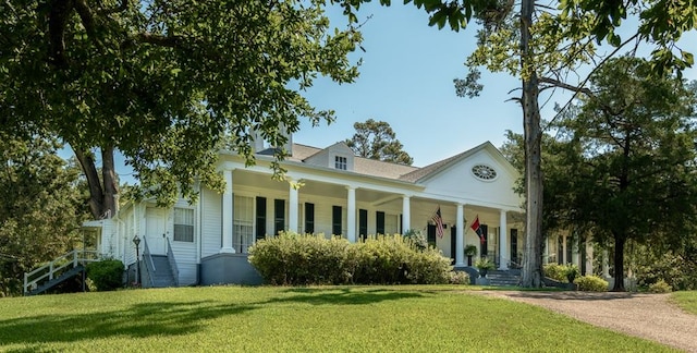 view of front of home featuring a front yard and covered porch