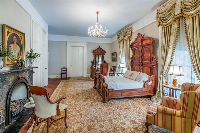 bedroom with a notable chandelier and hardwood / wood-style flooring