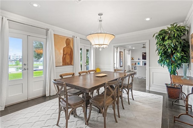 dining area with a healthy amount of sunlight, ornamental molding, and french doors