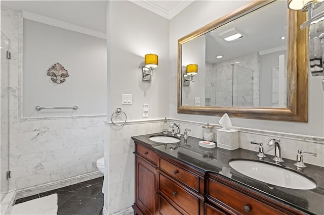 bathroom featuring crown molding, a stall shower, a sink, and double vanity