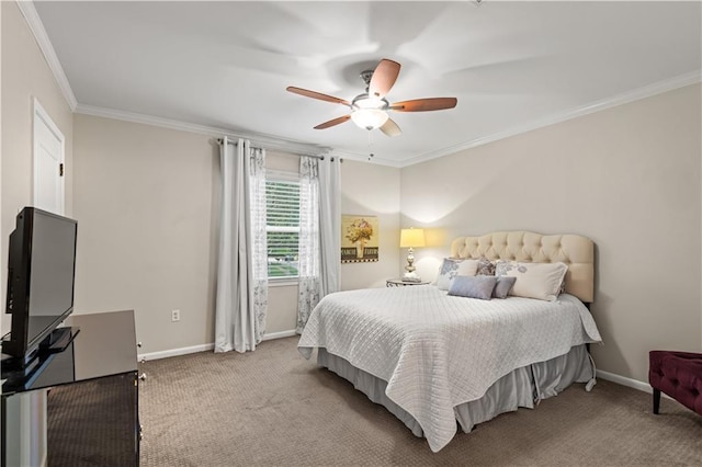 carpeted bedroom featuring baseboards, a ceiling fan, and crown molding