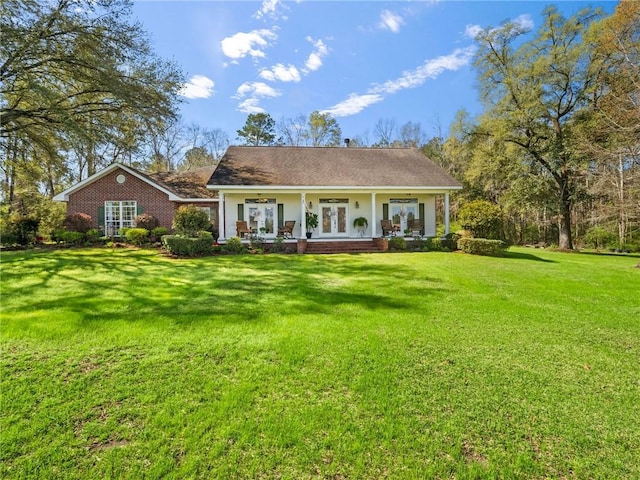 ranch-style home with a front lawn and a porch