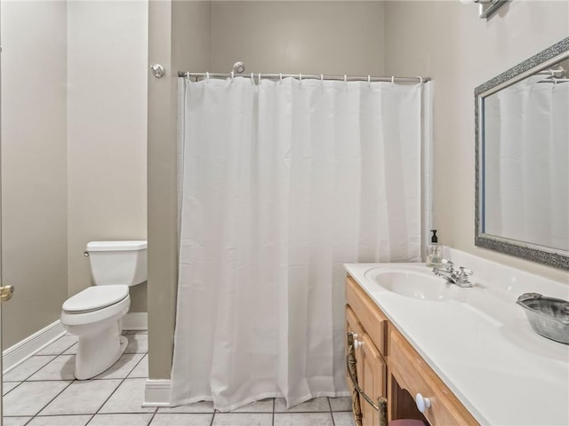 bathroom featuring a shower with shower curtain, vanity, toilet, and tile patterned floors