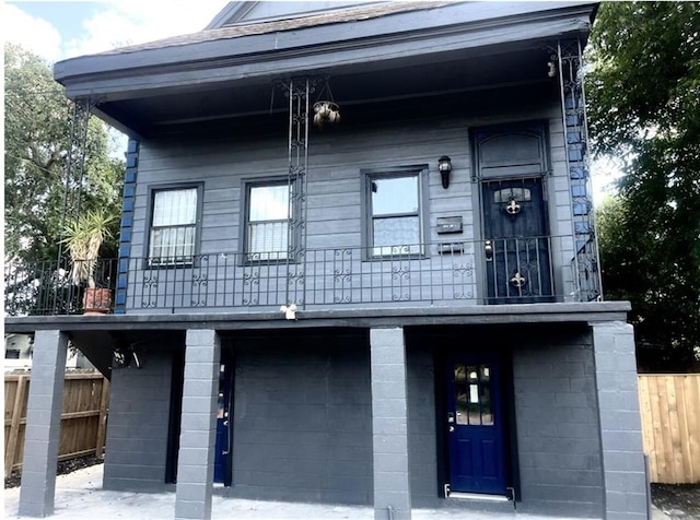 view of front of home with a balcony and a porch