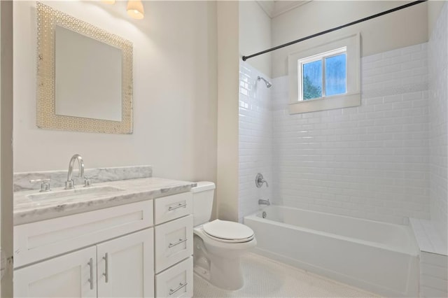 full bathroom featuring tiled shower / bath combo, vanity, and toilet