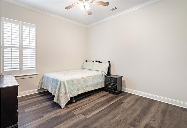 bedroom featuring ornamental molding, ceiling fan, and dark wood-type flooring