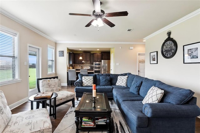 living room featuring hardwood / wood-style floors, ceiling fan, and a healthy amount of sunlight