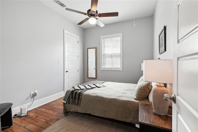 bedroom with wood-type flooring and ceiling fan