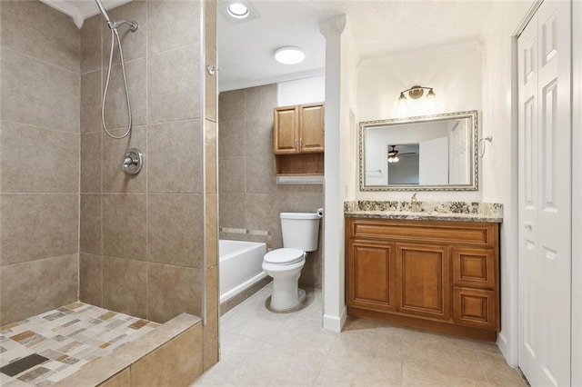 bathroom with vanity, ornamental molding, tile patterned floors, tile walls, and toilet