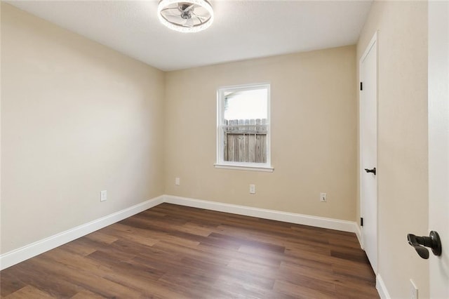 spare room featuring dark hardwood / wood-style flooring