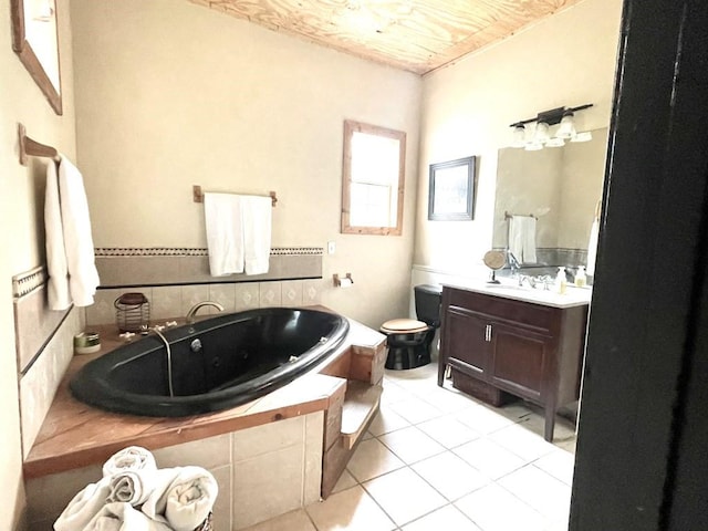 bathroom featuring vanity, tile patterned floors, and a bathtub