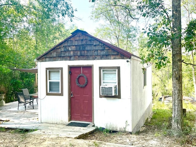 view of outbuilding with cooling unit