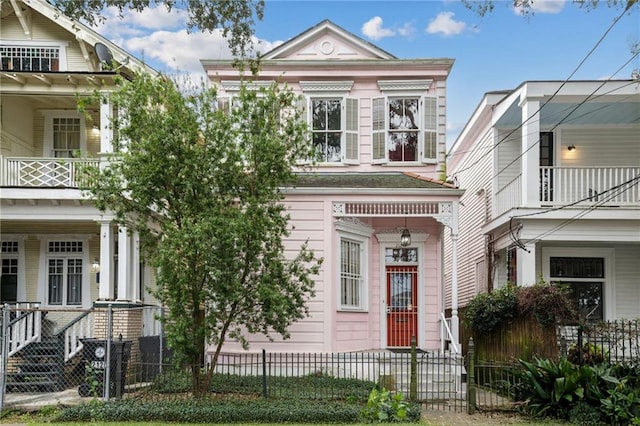 greek revival inspired property with a balcony