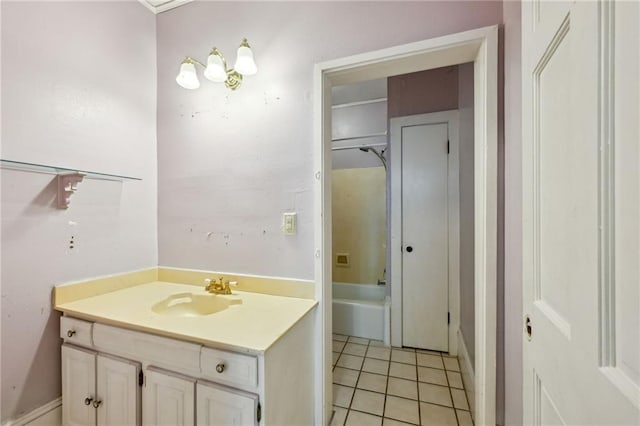 bathroom featuring tile patterned floors, vanity, and a tub