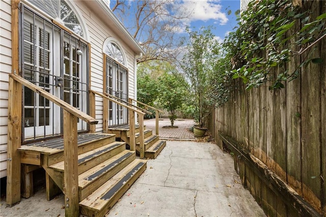 view of side of property with french doors and a patio