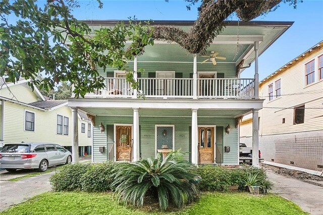 view of front of house featuring a balcony and covered porch