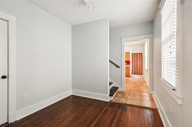 empty room with wood-type flooring