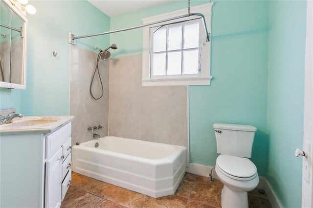 full bathroom featuring bathing tub / shower combination, vanity, and toilet