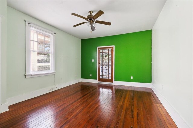 unfurnished room featuring ceiling fan and wood-type flooring