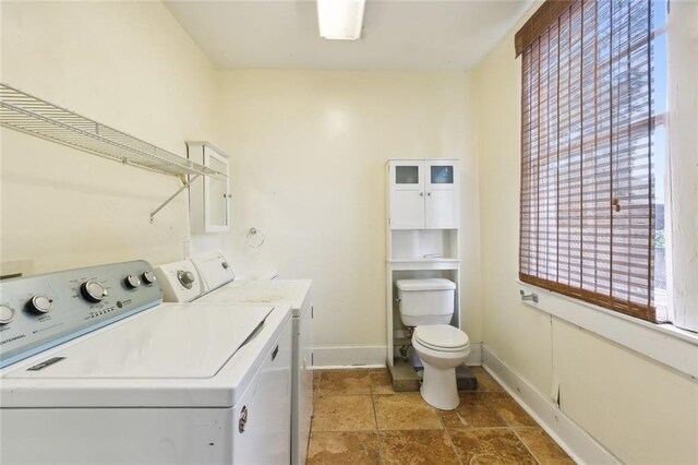 washroom featuring washing machine and dryer