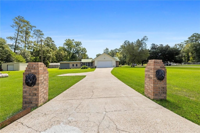 ranch-style home featuring a front yard and a garage