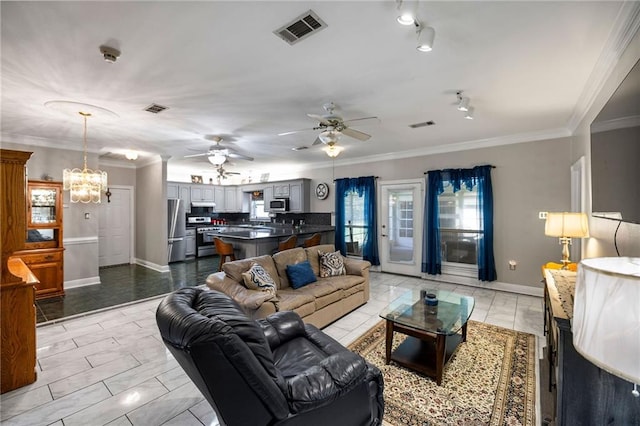 living room with light tile patterned floors, ceiling fan with notable chandelier, and ornamental molding