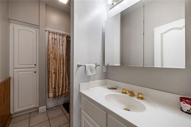 bathroom with tile patterned flooring and vanity