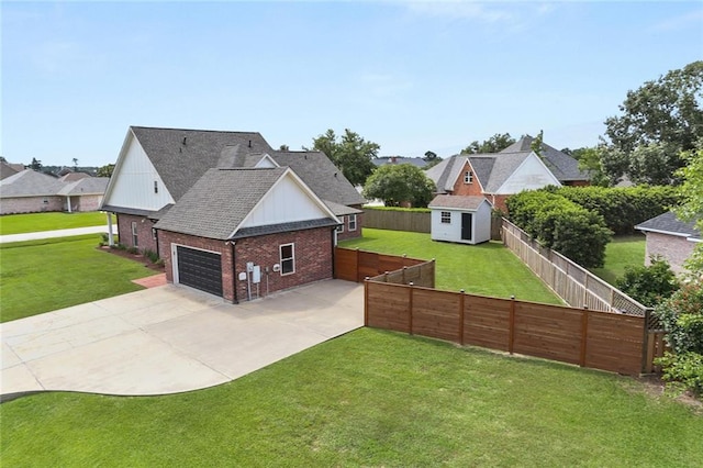 exterior space with a garage, a front lawn, and a shed