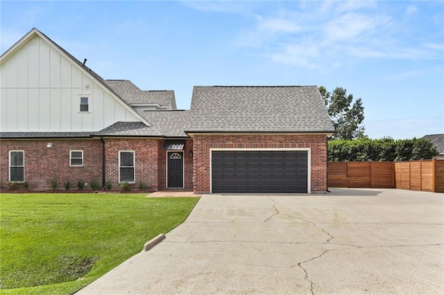 view of front of home with a front lawn and a garage